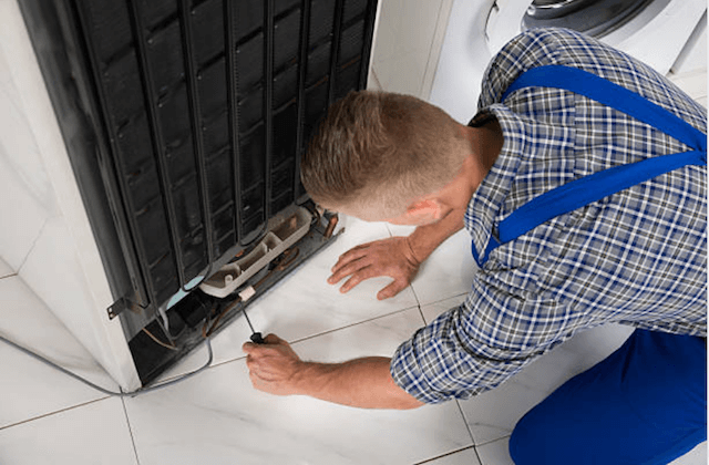 repairman fixing refrigerator in honolulu